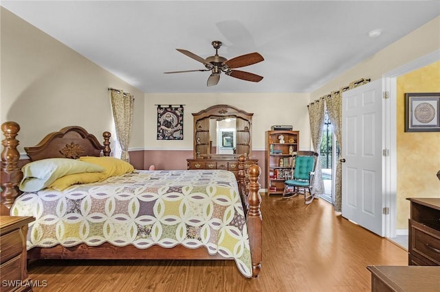 bedroom with ceiling fan and wood finished floors