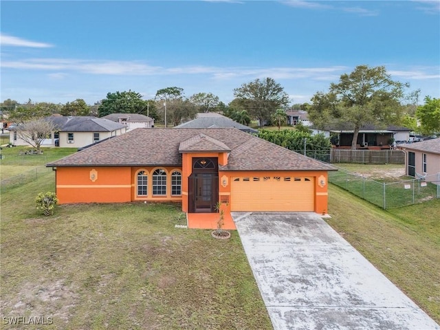 ranch-style home featuring a garage, concrete driveway, fence, a front yard, and stucco siding