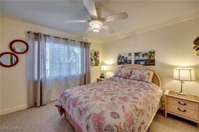 carpeted bedroom with baseboards, ornamental molding, and a ceiling fan