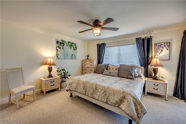 carpeted bedroom with baseboards, a ceiling fan, and crown molding