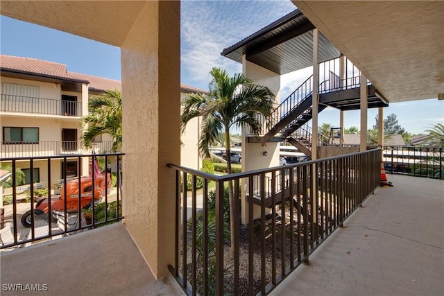 balcony featuring stairway