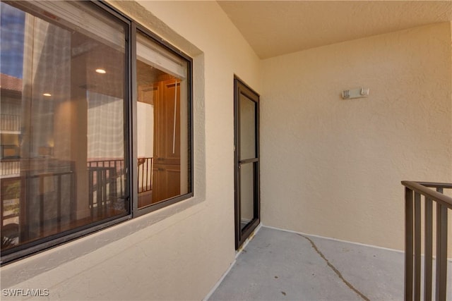 doorway to property with stucco siding