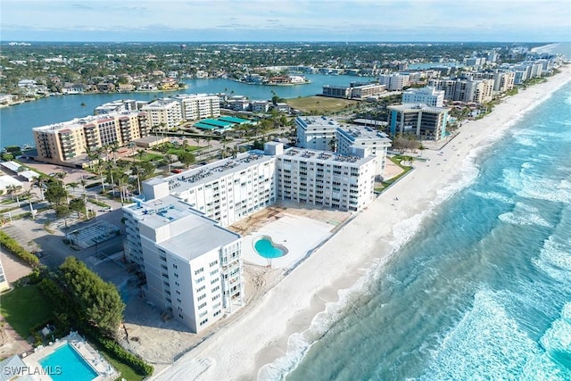 aerial view with a view of the beach, a water view, and a view of city