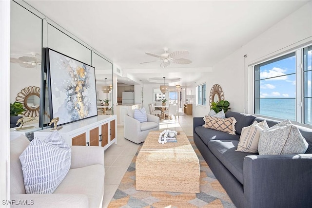 living room with light tile patterned floors, ceiling fan, and visible vents