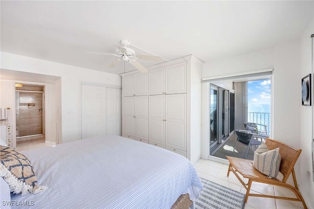 bedroom with access to outside, light tile patterned flooring, connected bathroom, and a ceiling fan