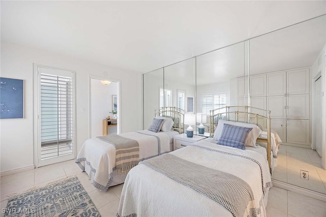 bedroom with light tile patterned floors