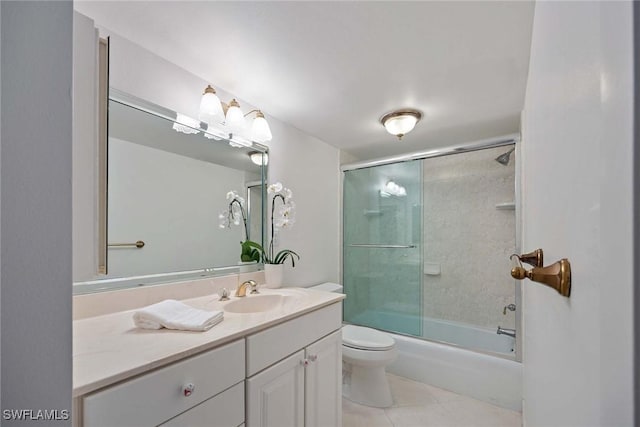 full bathroom featuring toilet, shower / bath combination with glass door, vanity, and tile patterned floors