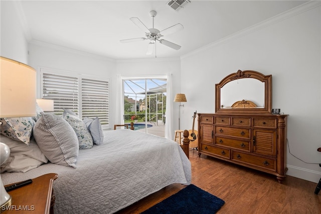 bedroom featuring access to exterior, visible vents, ornamental molding, wood finished floors, and baseboards