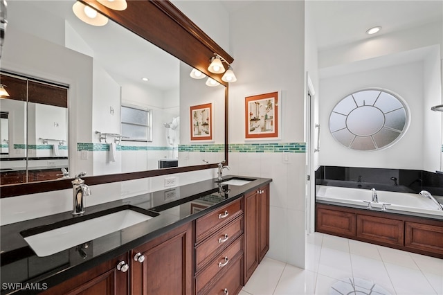 full bathroom featuring a bath, double vanity, a sink, and tile walls
