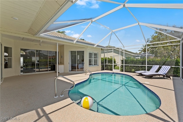 outdoor pool featuring ceiling fan, a patio, and a lanai