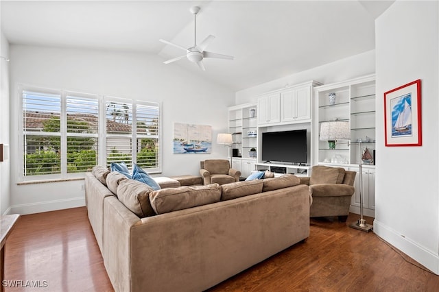 living area featuring lofted ceiling, dark wood-type flooring, a ceiling fan, and baseboards