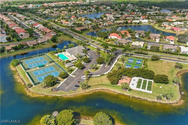 bird's eye view featuring a water view and a residential view