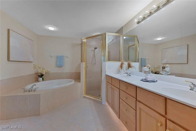 full bathroom featuring a garden tub, a stall shower, and a sink