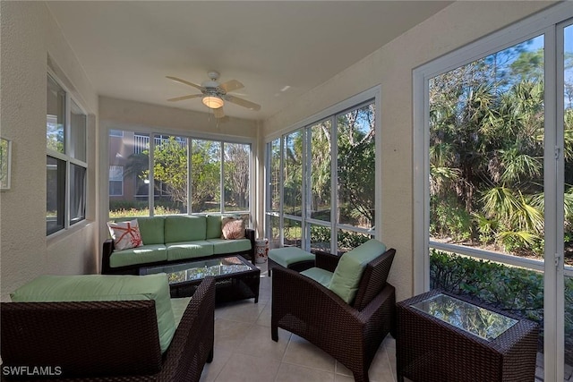 sunroom featuring a ceiling fan