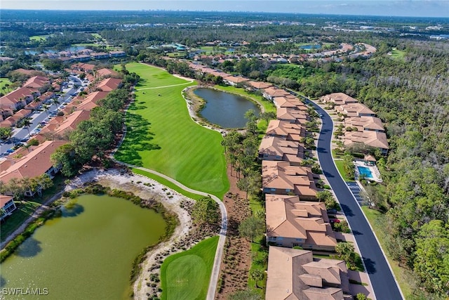 birds eye view of property with a water view, view of golf course, and a residential view