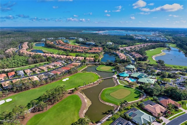 aerial view with golf course view, a water view, and a residential view