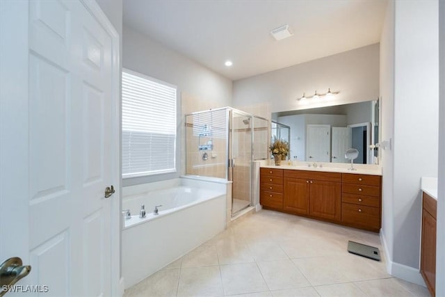 full bathroom featuring visible vents, tile patterned floors, vanity, a shower stall, and a bath