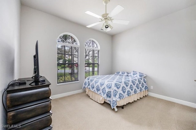 bedroom featuring carpet, baseboards, and ceiling fan