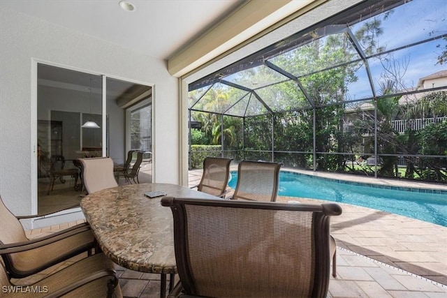 outdoor pool featuring a lanai and a patio