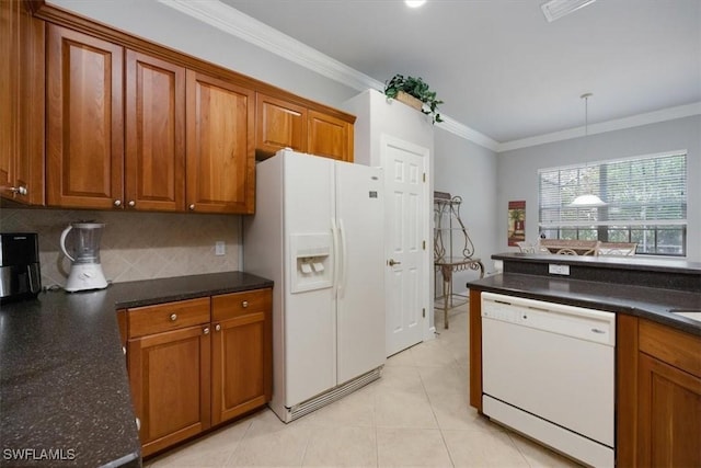 kitchen with ornamental molding, white appliances, decorative light fixtures, and brown cabinets