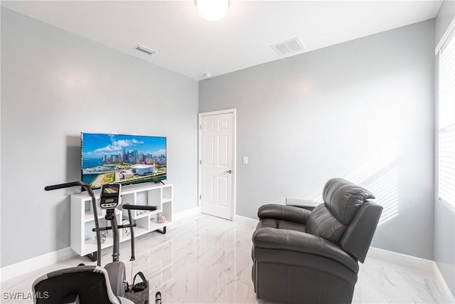 office area featuring marble finish floor, visible vents, and baseboards