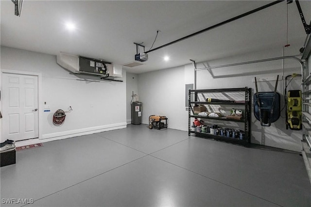 garage with water heater and a garage door opener