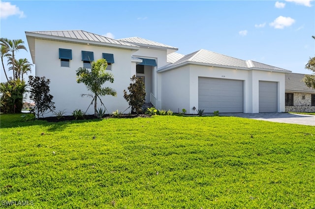 view of front of house featuring driveway, a front lawn, an attached garage, and stucco siding