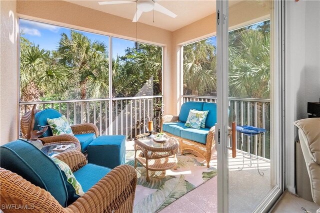 sunroom featuring a ceiling fan