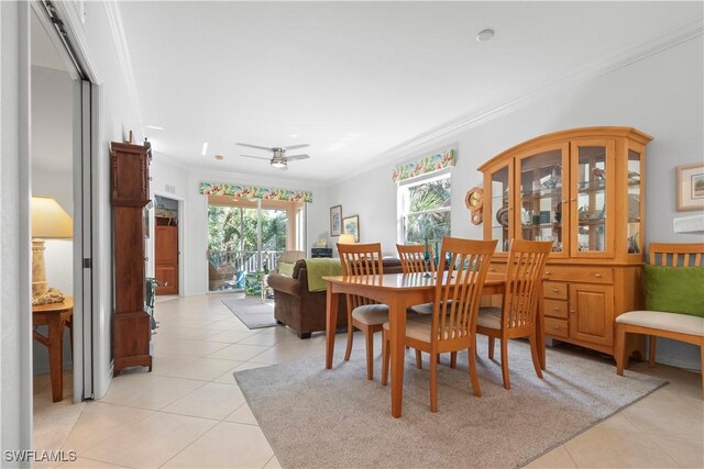 dining room featuring light tile patterned floors and ornamental molding