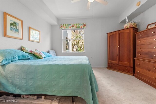 bedroom featuring ceiling fan and light colored carpet