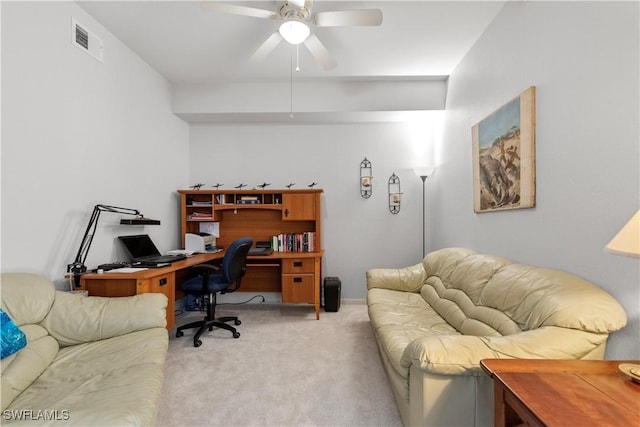 carpeted home office featuring visible vents and ceiling fan