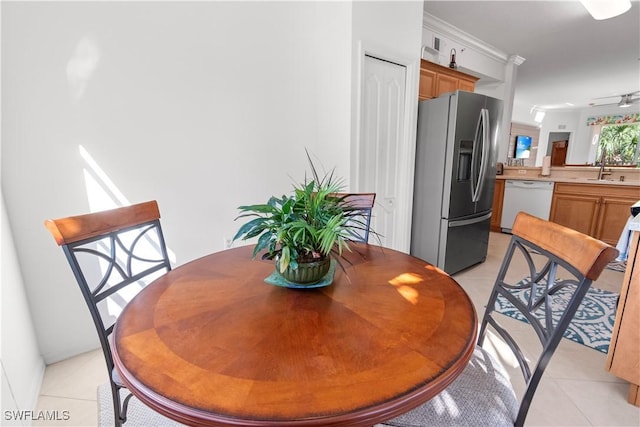 dining area featuring light tile patterned flooring and ceiling fan