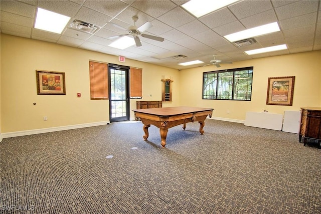 recreation room with visible vents, a drop ceiling, a wealth of natural light, and baseboards