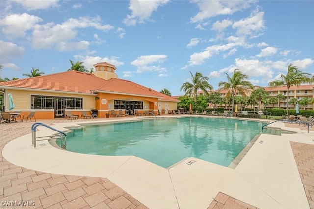 community pool with a patio