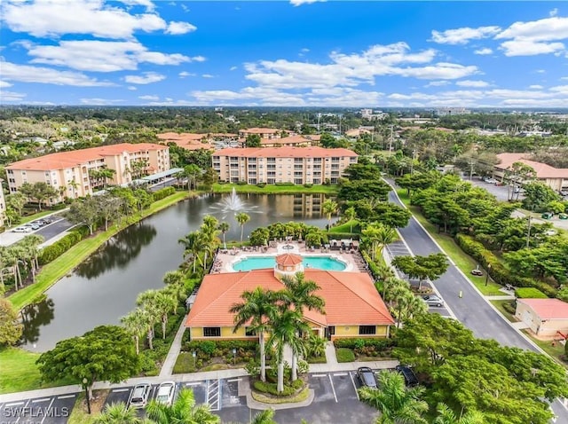 8261 Pathfinder Loop Unit 730, Fort Myers, FL 33919 - aerial view of a nearby body of water, a pool, and apartment complex / building