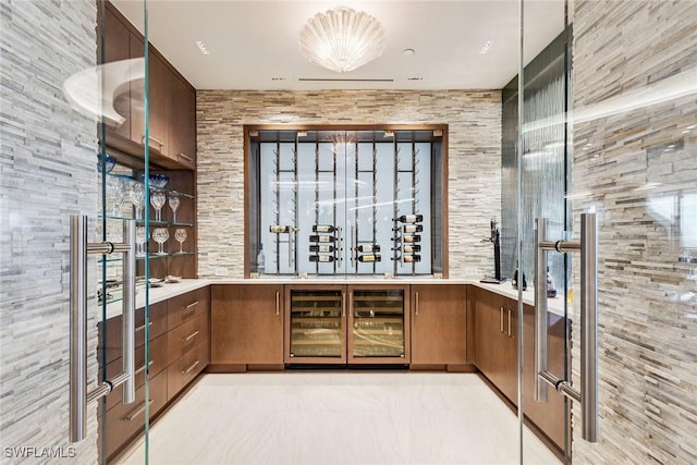 wine cellar with beverage cooler and light tile patterned flooring