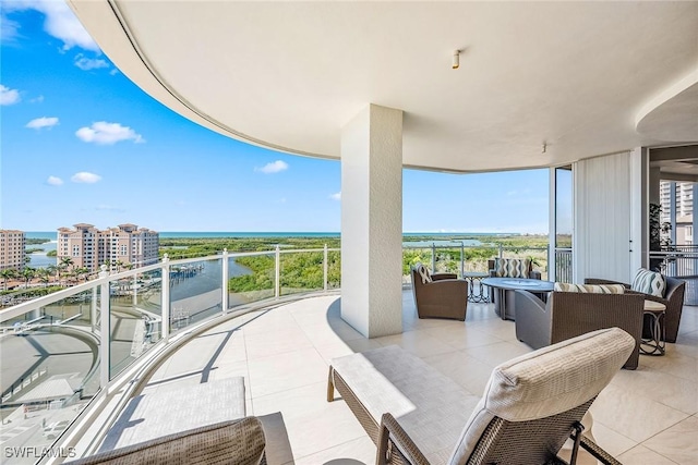 exterior space featuring a water view and a balcony
