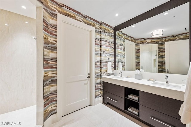 bathroom with a sink, recessed lighting, and double vanity