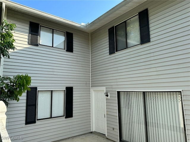 property entrance featuring an attached garage