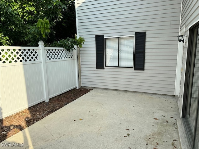 view of patio featuring fence