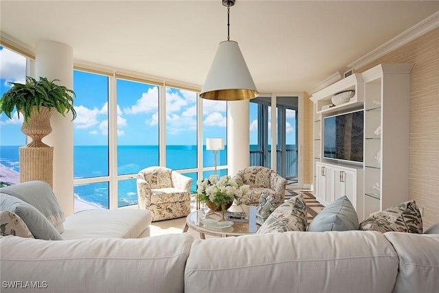 living area with a wall of windows and a water view