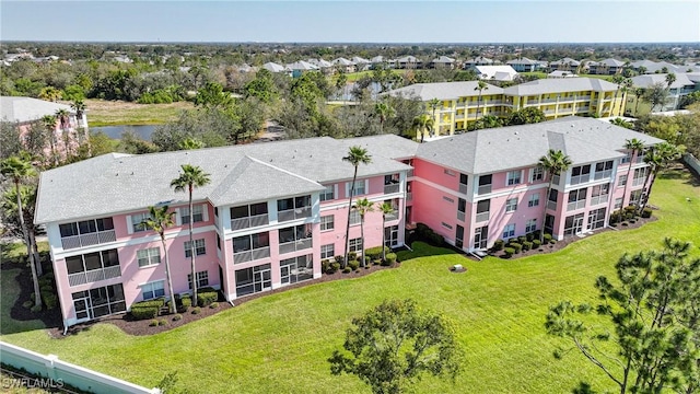 bird's eye view featuring a residential view and a water view