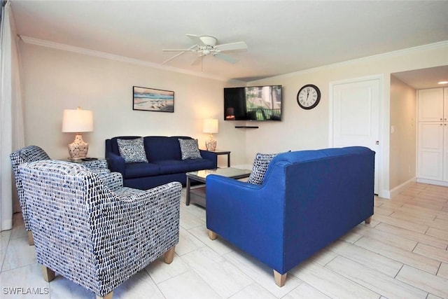 living room with baseboards, a ceiling fan, and crown molding