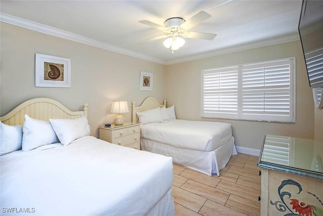 bedroom with ornamental molding, wood tiled floor, a ceiling fan, and baseboards