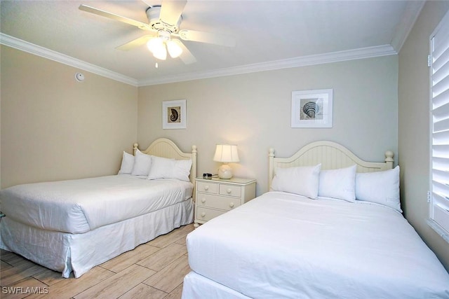 bedroom with crown molding, light wood finished floors, and ceiling fan