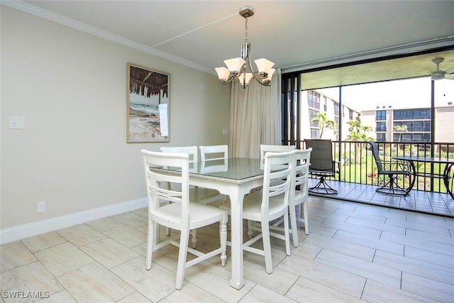 dining area featuring a chandelier, a sunroom, baseboards, a wall of windows, and crown molding