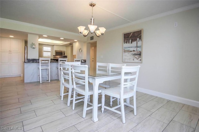 dining area featuring a chandelier, crown molding, recessed lighting, and baseboards