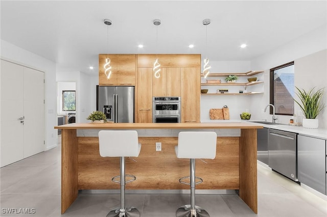 kitchen featuring light countertops, appliances with stainless steel finishes, open shelves, washer and clothes dryer, and modern cabinets