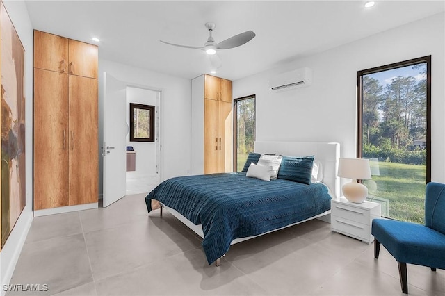 bedroom with recessed lighting, ceiling fan, and a wall mounted air conditioner