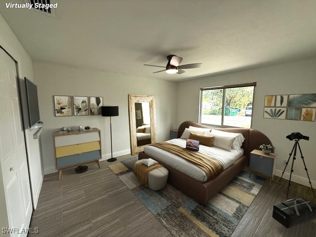 bedroom with ceiling fan and baseboards